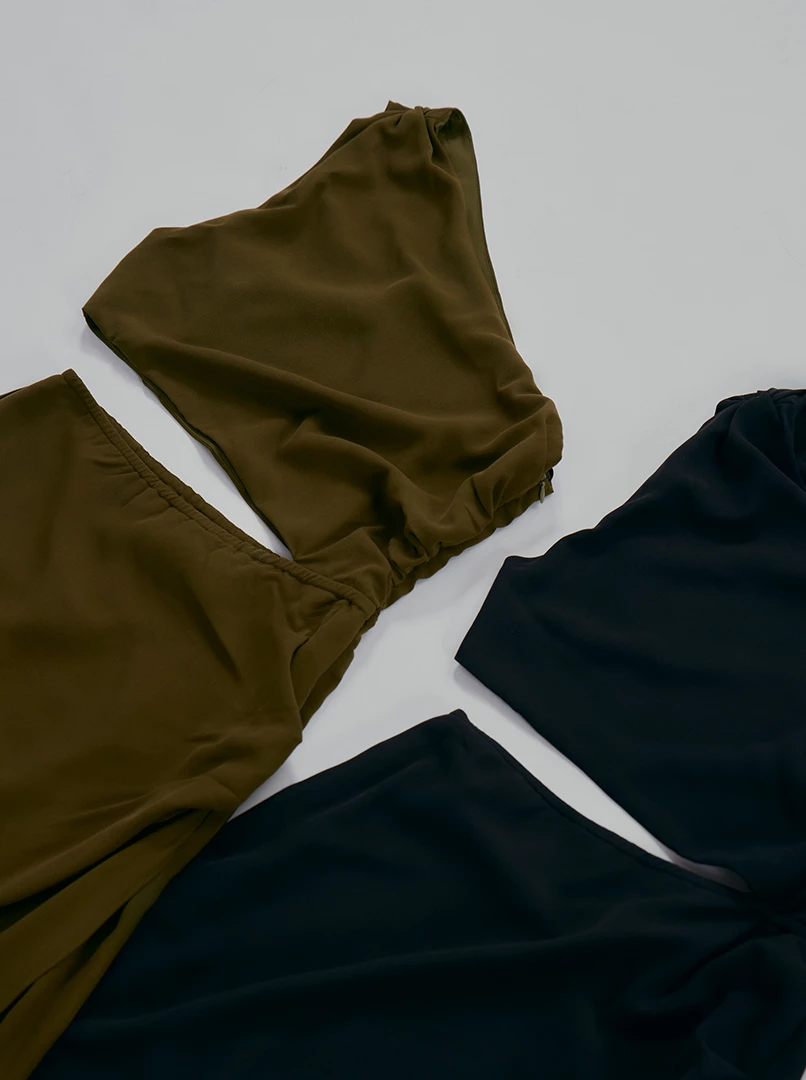 斜肩縷空連身裙